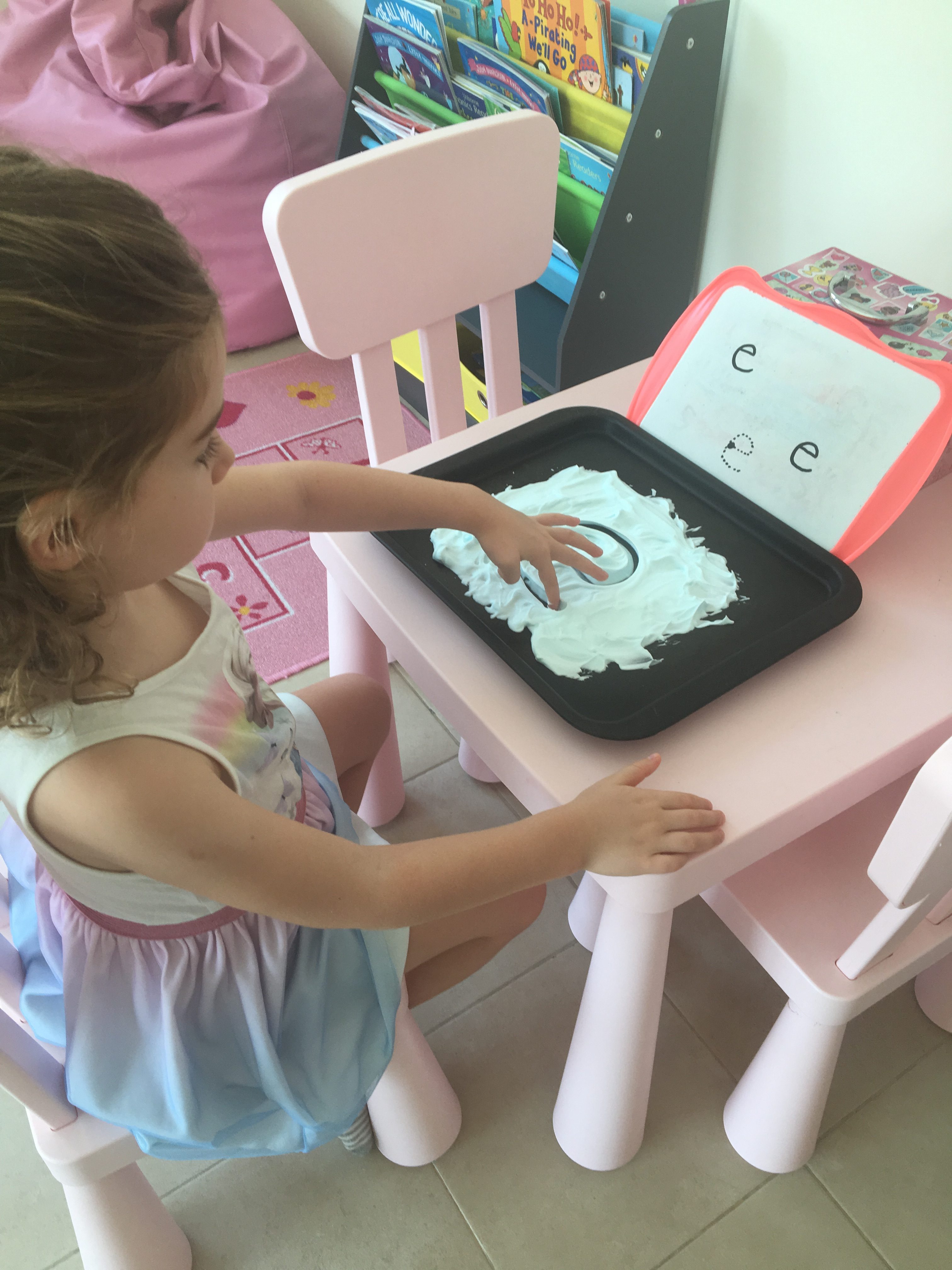 letter writing using baking tray with shaving cream and finger as pencil