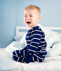 boy crying doesn't want to sleep